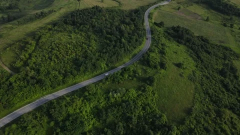 Aerial Drone View Car Driving on Curvy Mountain asphalt Road in summer 스톡 동영상 244493425