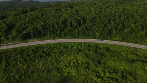 Aerial Drone View Car Driving on Curvy Mountain asphalt Road in summer Stock Footage 244493571