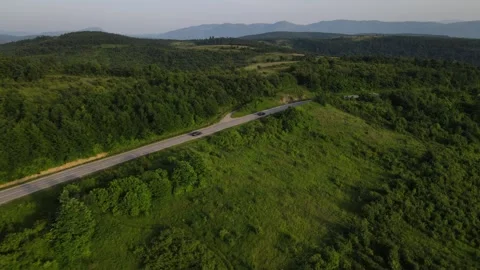 Aerial Drone View Car Driving on Curvy Mountain asphalt Road in summer 스톡 동영상 244493580