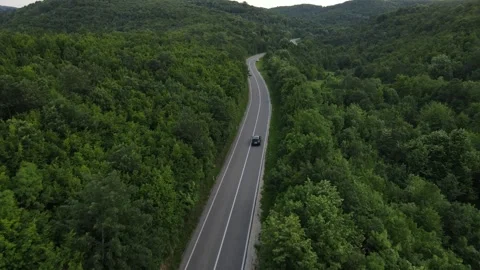 Aerial Drone View Car Driving on Curvy Mountain asphalt Road in summer 스톡 동영상 244884041