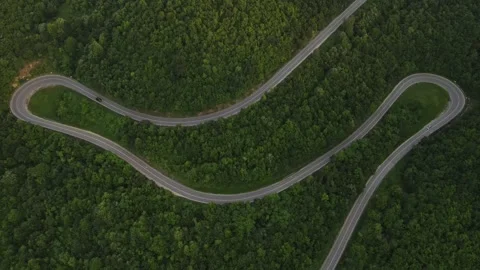 Aerial Drone View Car Driving on Curvy Mountain asphalt Road in summer Stock Footage 244884232