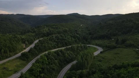 Aerial Drone View Car Driving on Curvy Mountain asphalt Road in summer Stock Footage 245457463