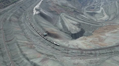 Aerial drone view of cargo train in open coal mine pit, heavy industry China Stock Footage 67520190