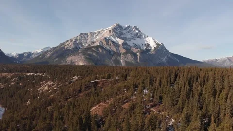 Aerial drone view of Cascade Mountain above pine forest, Banff National Park Stock Footage 330950852
