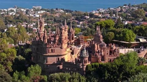Aerial Drone View of Castillo de Colomares Sandstone Spires and Sea Stock Footage 335446121