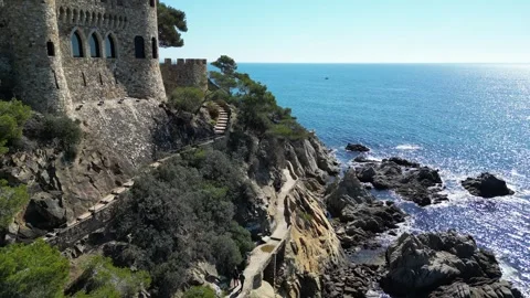 Aerial drone view, castle in Lloret de Mar, rocks, cliffs, beach, mountains, 4K Stock Footage 274852238