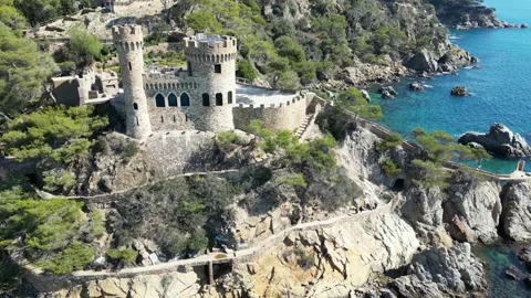 Aerial drone view, castle in Lloret de Mar, rocks, cliffs, beach, mountains, 4K Stock Footage 274852243