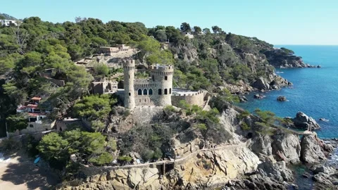 Aerial drone view, castle in Lloret de Mar, rocks, cliffs, beach, mountains, 4K Stock Footage 274852247