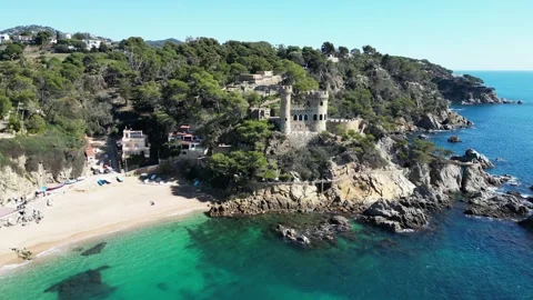 Aerial drone view, castle in Lloret de Mar, rocks, cliffs, beach, mountains, 4K Stock Footage 274852285