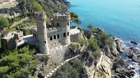 Aerial drone view, castle in Lloret de Mar, rocks, cliffs, beach, mountains, 4K Stock Footage 274852293