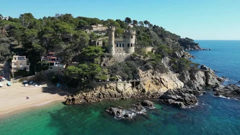 Aerial drone view, castle in Lloret de Mar, rocks, cliffs, beach, mountains, 4K Stock Footage 274852307