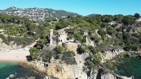 Aerial drone view, castle in Lloret de Mar, rocks, cliffs, beach, mountains, 4K Stock Footage 274855375