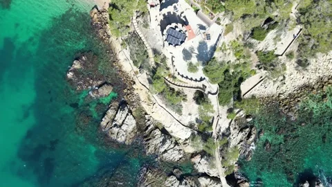 Aerial drone view, castle in Lloret de Mar, rocks, beach, solar panels, 4K Stock Footage 274855593