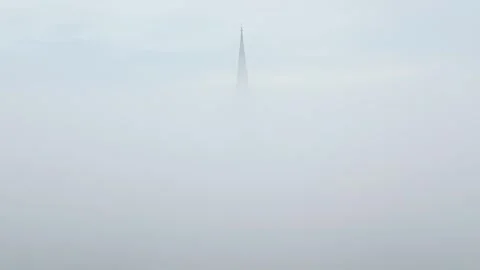 Aerial Drone View of Cathedral Spire Piercing Thick Fog Vidéo 344012842