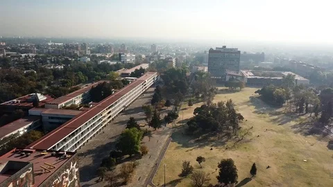 Aerial drone view of the central campus of UNAM, Mexico City Stock Footage 104434133