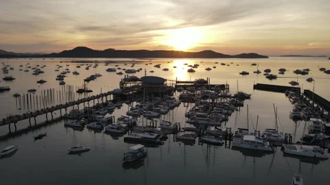 Aerial drone view of Chalong Pier during sunrise in Phuket, Thailand Stock-Footage 263396341