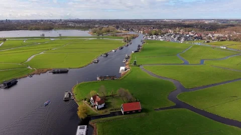 Aerial drone view of a classic Dutch water landscape with rowing boats 스톡 동영상 332444530