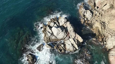 Aerial drone view, clean blue sea water waves, rocks, mediterranean seascape, 4K Stock Footage 274459239
