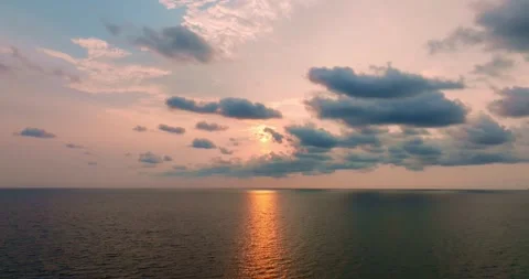 Aerial drone view of clear turquoise sea and waves over the ocean with sunset Video stock 262451604