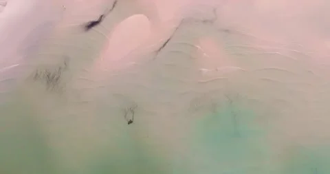 Aerial drone view of clear turquoise sea and waves over the beach Stock Footage 280821079