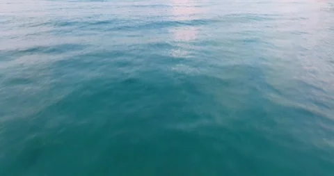 Aerial drone view of clear turquoise sea and waves over the ocean Stock Footage 280821089