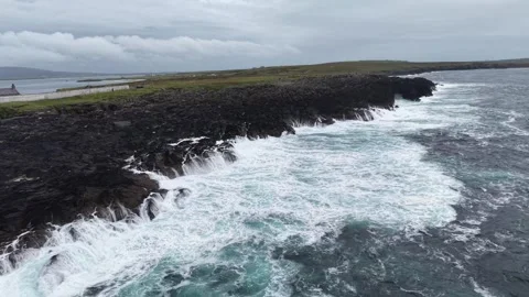 Aerial drone view on a cliff with a lighthouse, Ireland. Stock Footage 342730335