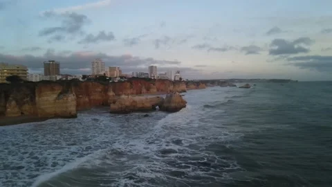 Aerial drone view of cliffs and beaches in Portimao during the sunset Stock Footage 167923447
