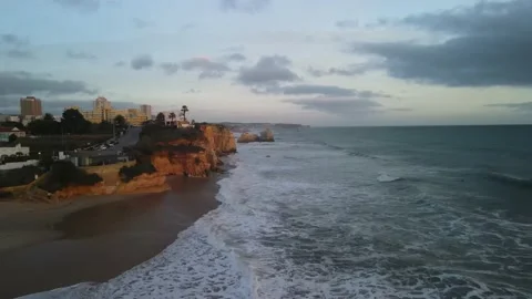 Aerial drone view of cliffs and beaches in Portimao during the sunset Stock Footage 167923486
