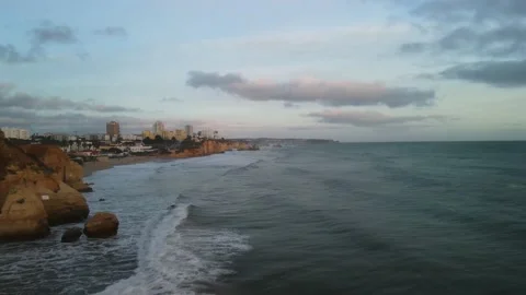 Aerial drone view of cliffs and beaches in Portimao during the sunset Stock Footage 167923500