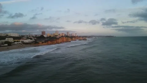 Aerial drone view of cliffs and beaches in Portimao during the sunset Stock Footage 167923503