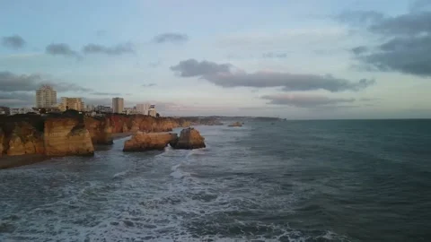 Aerial drone view of cliffs and beaches in Portimao during the sunset Stock Footage 167923525