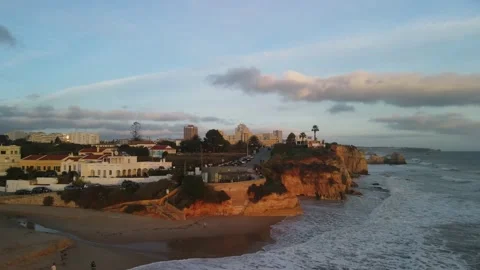 Aerial drone view of cliffs and beaches in Portimao during the sunset Stock Footage 167923529