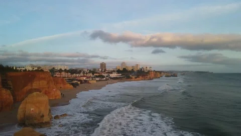 Aerial drone view of cliffs and beaches in Portimao during the sunset Stock Footage 167923560
