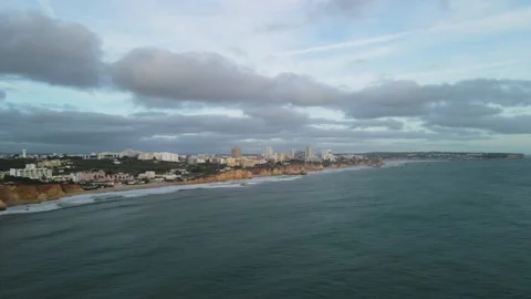 Aerial drone view of cliffs and beaches in Portimao during the sunset Stock Footage 167923656