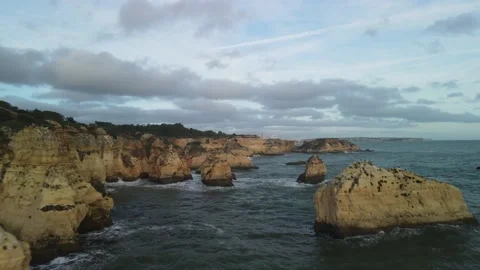 Aerial drone view of cliffs and beaches in Portimao during the sunset Stock Footage 167923675