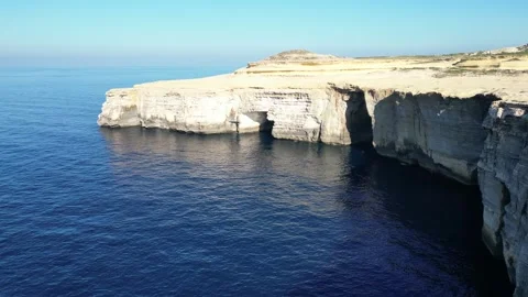 Aerial drone view of cliffs in Malta and the Mediterranean Sea Video stock 247429334