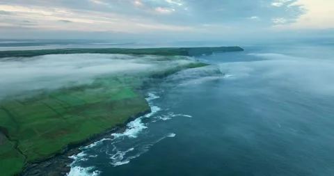 Aerial drone view of Cliffs of Moher covered in morning fog at sunrise, Ireland Stock Footage 339503566