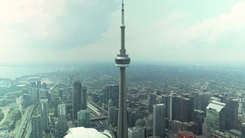 Aerial drone view of CN Tower and Toronto skyline on rainy cloudy day with Stock Footage 328210328