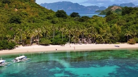 Aerial drone view of Coco Beach, with its golden sands and crystal-clear waters. Stock Footage 295914095