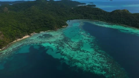 Aerial drone view of Coco Beach, with its golden sands and crystal-clear waters. Stock Footage 295914302
