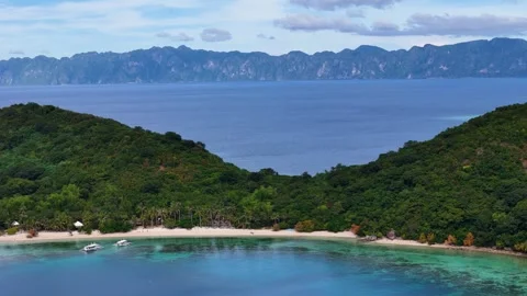 Aerial drone view of Coco Beach, with its golden sands and crystal-clear waters. Stock Footage 295915012