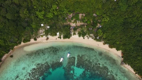 Aerial drone view of Coco Beach, with its golden sands and crystal-clear waters. Stock Footage 295915073
