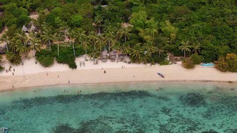 Aerial drone view of Coco Beach, with its golden sands and crystal-clear waters. Stock Footage 295915253