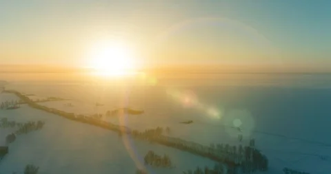 Aerial drone view of cold winter landscape with arctic field, trees covered with Stock Footage 129241777