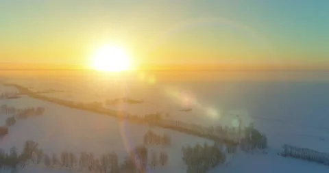 Aerial drone view of cold winter landscape with arctic field, trees covered with Stock Footage 151293921