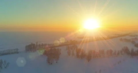 Aerial drone view of cold winter landscape with arctic field, trees covered with Stock Footage 282440440