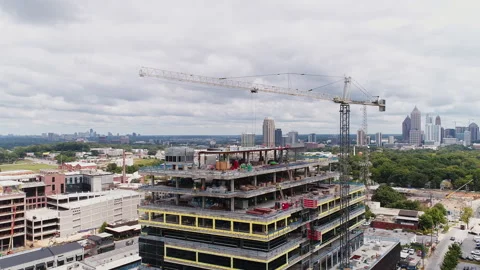 Aerial Drone View of Construction Crane and Workers Building Stock Footage 138963104
