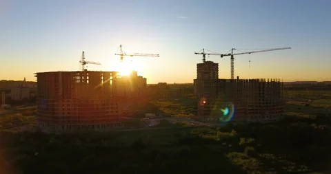 Aerial drone view of construction of a new residential complex at sunset 스톡 동영상 169408575