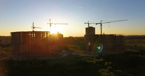 Aerial drone view of construction of a new residential complex at sunset 스톡 동영상 169408854