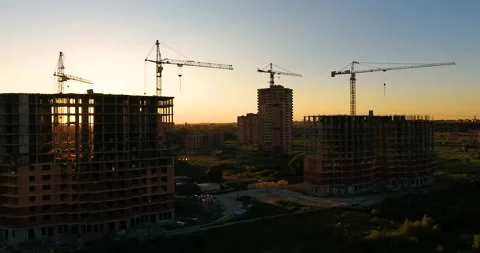 Aerial drone view of construction of a new residential complex at sunset 스톡 동영상 169409159